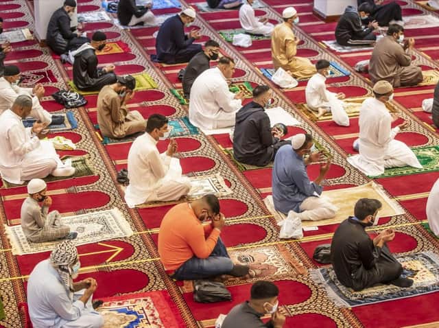 Worshippers observe strict social distancing during Eid prayers on Friday (July 31). Pic credit: Danny Lawson/PA Wire