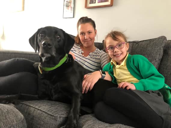 Mia Ellery, of Lostock Hall, with her seven-year-old daughter Honour and her dog Bentley.