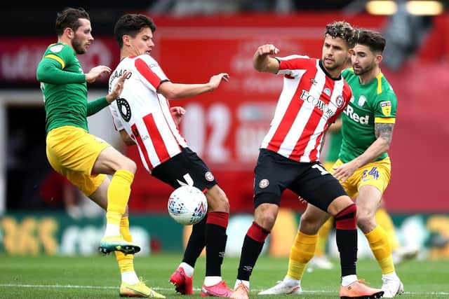 Preston North End's Alan Browne and Sean Maguire in action against Brentford at Griffin Park in July