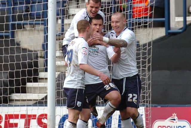 Bailey Wright celebrates his goal with Stuart Beavon, John Welsh and Jack King