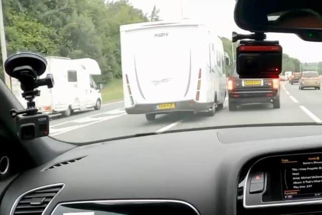 The speeding campervan manages to narrowly miss the motorist who caught the incident on camera and the Land Rover in front. (Credit: Barrie Crampton)