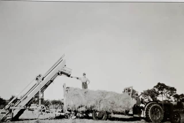 Haymaking, Rantree Fold, Tatham, in the 1950s. Richard Hodgson can be seen standing on the trailer with his wife driving the tractor. They are using a hay loader to load loose hay in the big meadow at their farm in Tatham. This method was designed to be quicker than using the traditional method of making hay plats and loading by hand with a hay fork. However, most local farmers still remained loyal to the traditional manual method, until the use of modern hay bailers became widespread in the early 1960s.