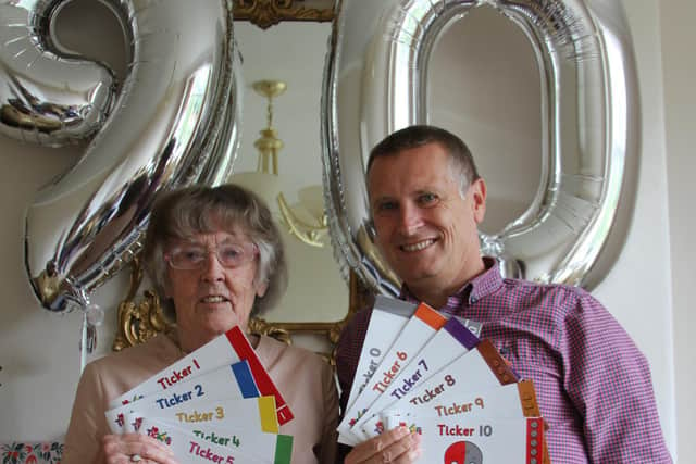 Jean Fisher celebrating her 90th birthday with the childrens educational books she has co-written with her son Ian.