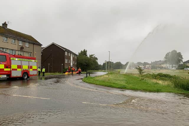 Firefighters attempt to tackle the floodwater in Lentworth Drive.