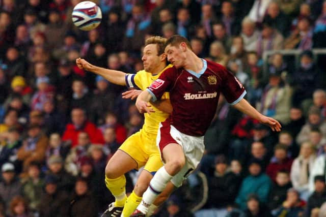 PNE skipper Paul McKenna challenges in the air with Burnley's Chris McCann