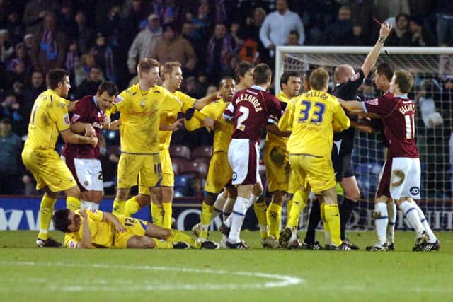 Chris McCann's red card for a foul on Sean St Ledger sparks a melee in PNE's win at Burnley