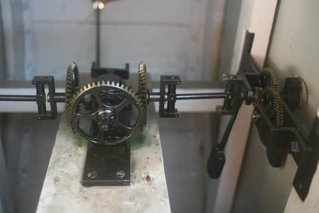 Rarely seen, this is the gearing between the clock faces where the turning of the rod coming in from the back (from the long case by the platform) is converted to turn the gears which drive the hands on the clock faces. Picture by Robert Swain.