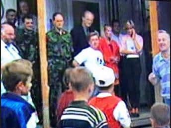 A grainy image taken from TV footage shows Col Waters with Princess Diana in Bosnia just days before she was killed in a car crash.