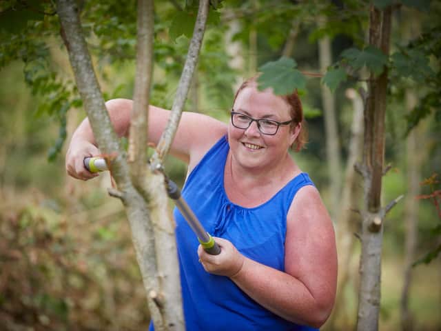 David Wilson Homes have donated money to The Girl Guides in Preston to buy tools for them to clear shrubs at their campsite in Silverdale, Lancashire.
Pictured volunteer Barbara Lawson using the loppers bought with the donation.
