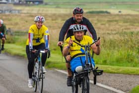 Matt Hellyer and Ben Parkinson of charity Pilgrim Bandits completing a 1,000-mile fund-raising cycle.