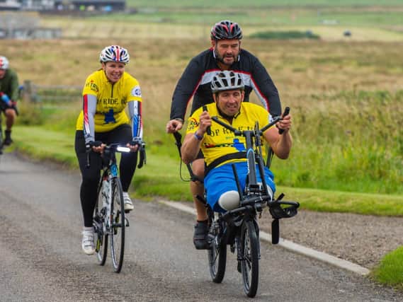 Matt Hellyer and Ben Parkinson of charity Pilgrim Bandits completing a 1,000-mile fund-raising cycle.