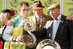 Winning jockey Leighton Aspell (left) and Many Clouds owner Trevor Hemmings (right) celebrate after victory in the Grand National Chase in 2015