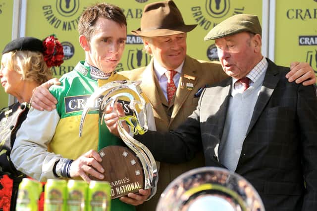 Winning jockey Leighton Aspell (left) and Many Clouds owner Trevor Hemmings (right) celebrate after victory in the Grand National Chase in 2015