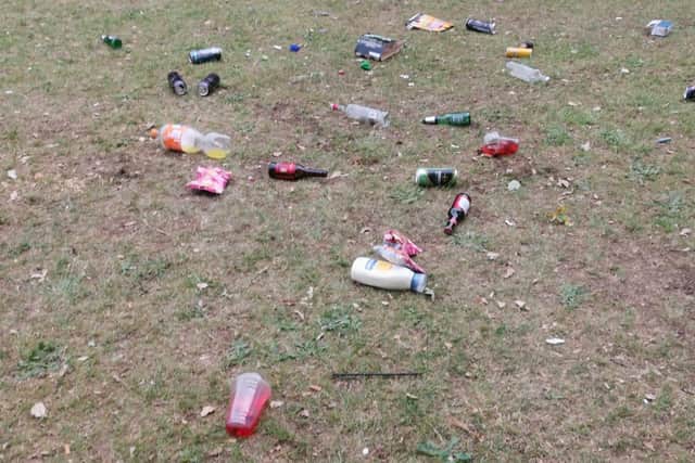 Beer bottles and litter left on the park