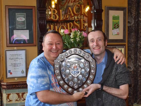 David Bell, then-Chairman of CAMRA Central Lancashire, awarding Dan Taylor with The George Lee Memorial Trophy
