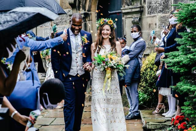 Mr and Mrs at last - smiles from Hollie and Malcolm as they leave St Anne's church, Woodplumpton and are showered with the rose petal confetti made by Hollie's mum Photo: Tiffany LS Photography