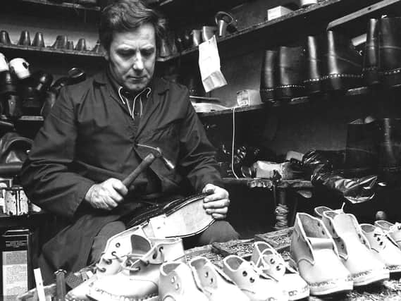 A master of his craft: Reuben Truswell pictured making clogs