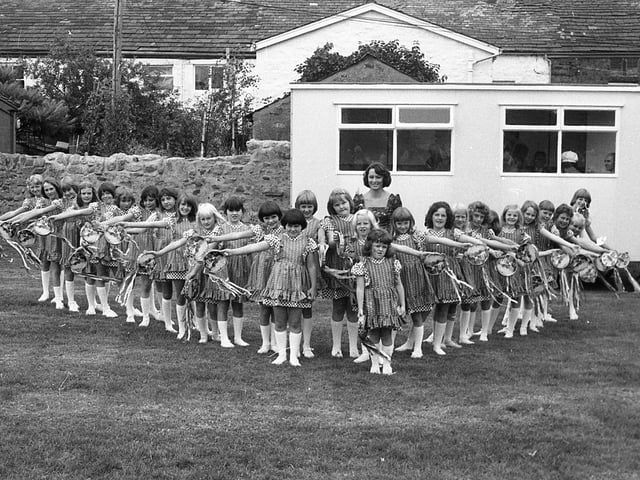 The village of Ribchester gave itself over to fun and frolics when the annual Field Day was held there. The Ribchester morris dancers, a team of 26 local girls, went through their paces on the village field, and are pictured above