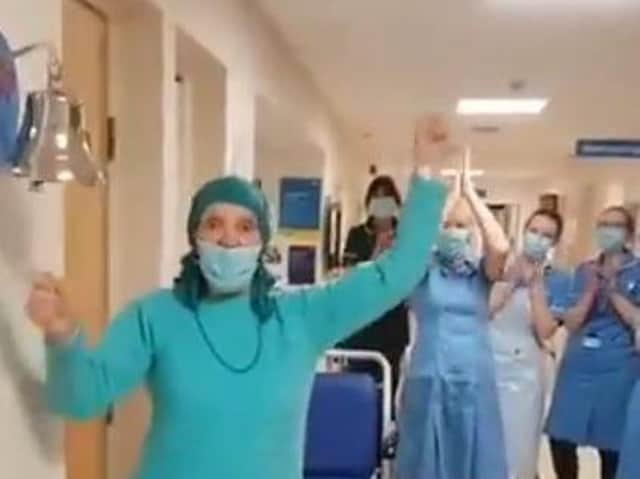 Anne Nolan rings the hospital bell to signal the end of her chemotherapy treatment