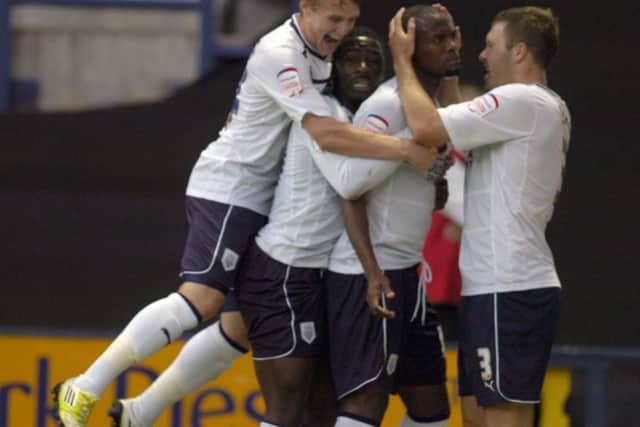 Will Hayhurst, Jeffery Monakana and Scott Laird congratulate Akpo Sodje after his goal for PNE against Crystal Palace