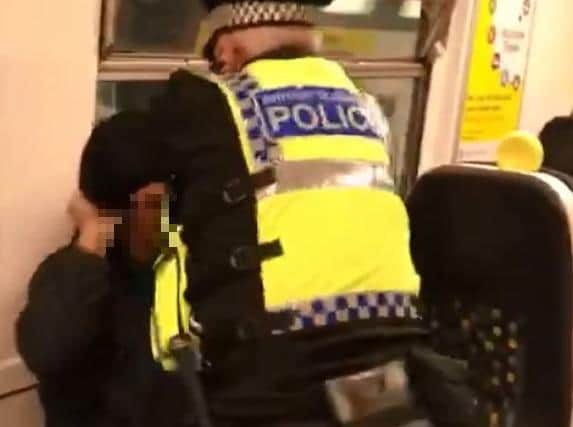 A struggle ensued with the officer saying, "I'll spray you mate" as the man refused to leave the train