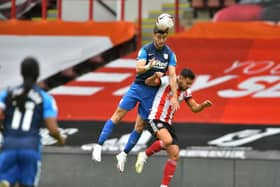 Preston North End left-back Andrew Hughes challenges in the air against Sheffield United at Bramall Lane  Pic courtesy of PNE