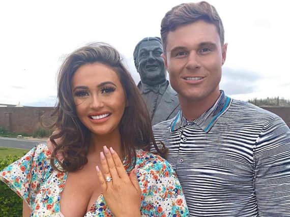 Charlotte Dawson is engaged. Matt Sarsfield pops the question in front of her father's statue in the Sunken Gardens in North Promenade. (picture: Charlotte Dawson Instagram)