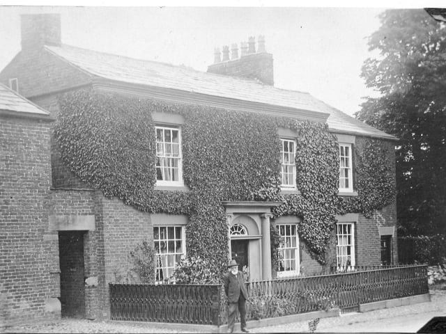 Thomas Cross Wignall standing outside Grove House, Freckleton. Three generations of Wignall family were leading members of the Freckleton Wesleyan Methodist community