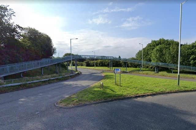 Two boys were riding along the raised footbridge over Wood Lane when they were approached by a man who began to threaten them. (Credit: Google)