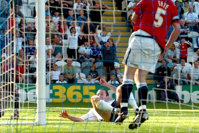 Stephen Elliott slides in to score PNE's second goal against Swansea