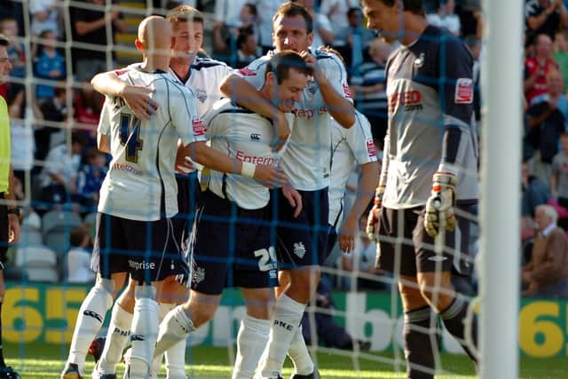 Stephen Elliott is congratulated by his Preston North End team-mates after scoring against Swansea at Deepdale in September 2009