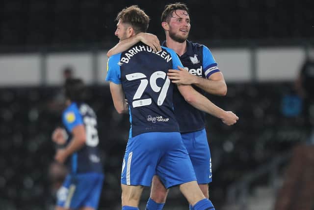 Tom Barkhuizen is congratulated by Alan Browne after scoring Preston North End's equaliser at Derby
