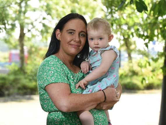 Julie, with 18 month old Isabella, who can't return to nursery until she has had a covid test