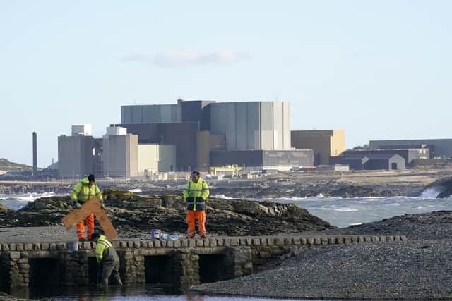 Workers carrying out early ground work in preparation for the replacement power station at Wylfa. Work stopped in 2019 and has now been shelved