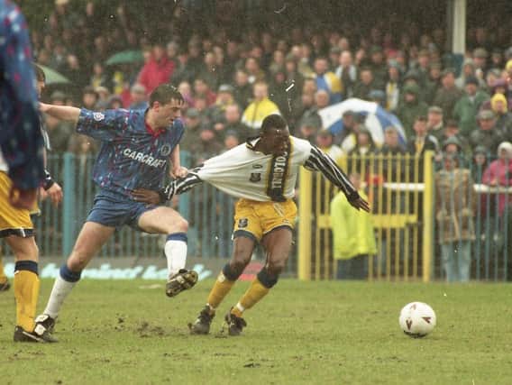 Preston left-back Terry Fleming has his shirt tugged in the 1-0 win over Rochdale at Spotland in April 1995