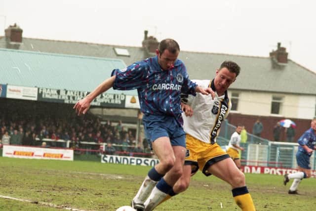PNE midfielder Ian Bryson challenges for the ball against Rochdale