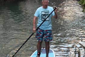 Chris shows off his paddleboarding expertise on the Grand Canal, Venice