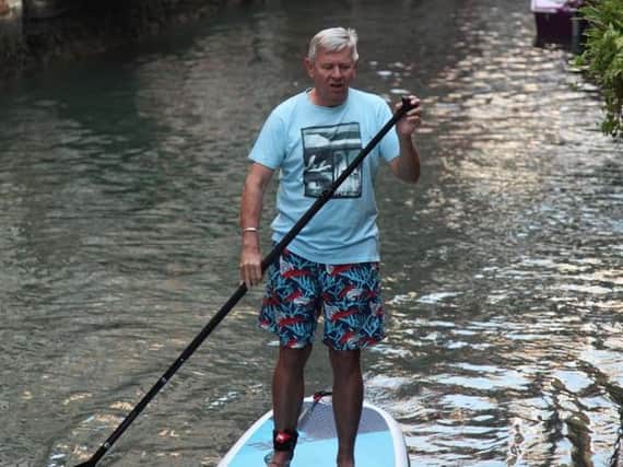Chris shows off his paddleboarding expertise on the Grand Canal, Venice