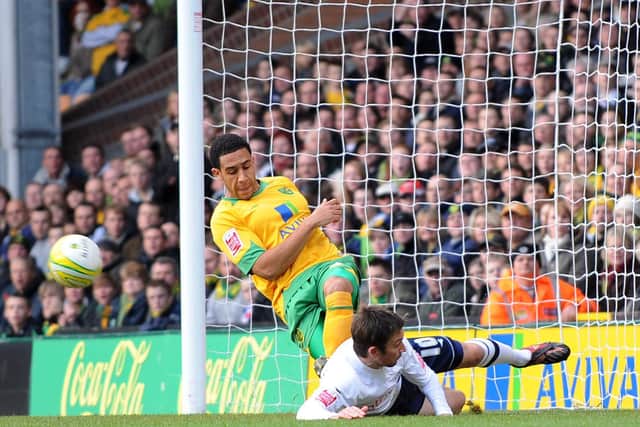 PNE midfielder Barry Nicholson slides in with Jon Otsemobor to set-up the opening goal against Norwich