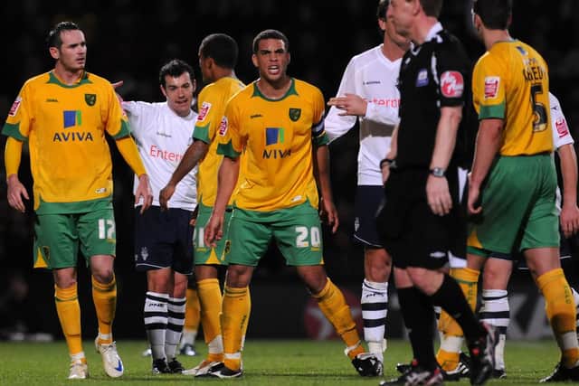Referee Paul Taylor prepares to send-off Norwich skipper Darel Russell (No.20) after he clashed with Ross Wallace