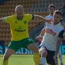Patrick Bauer and Norwich striker Teemu Pukki challenge for the ball