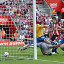 Preston's David Nugent and Liam Chilvers makes sure the ball crosses the line as Southampton's Gareth Bale looks on