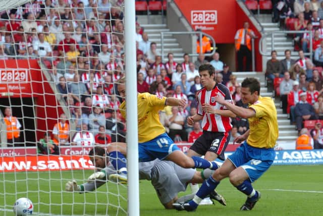 Preston's David Nugent and Liam Chilvers makes sure the ball crosses the line as Southampton's Gareth Bale looks on