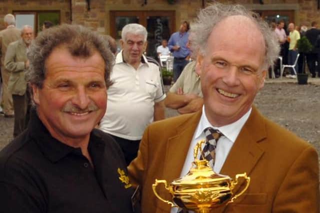 Charles Downes, left, and Sandy Jones, former chairman of the Association of National PGAs with the Ryder Cup at the opening of the Oak Royal Golf and Country Club