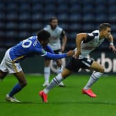 PNE winger Billy Bodin tries to escape the clutches of Brighton's Bernando Fernandes at Deepdale