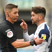 Preston striker Sean Maguire makes his point to referee Matt Donohue during the defeat to Stoke