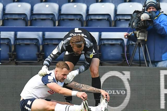 Declan Rudd helps PNE team-mate Patrick Bauer