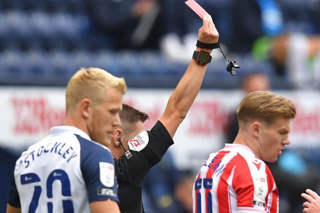 Referee Matt Donohue sends-off Tom Barkhuizen as Jayden Stockley and James McClean watch on