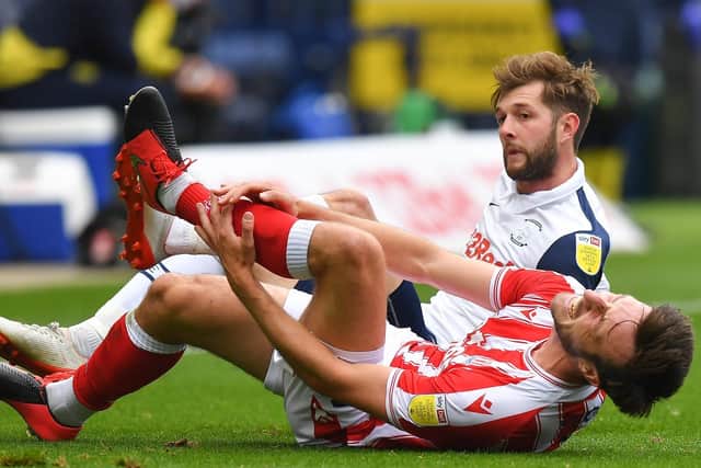Tom Barkhuizen and Morgan Fox in the aftermath of the challenge which led to the PNE winger being sent-off