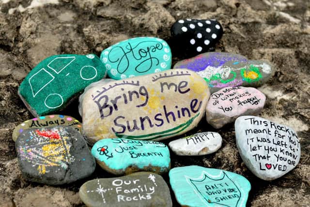 Jacky Burns started off a new craze in the Heysham area called Pebbleart - she finds pebbles on the beach, paints and varnishes them, then hides them in the local area for people to find. She passed away on September 14 and people are being asked to paint pebbles purple for a permanent memorial for Jacky.